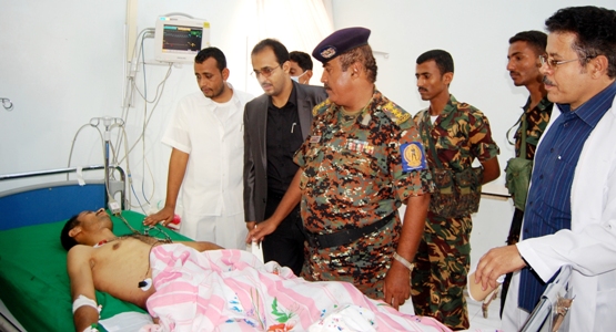 Visiting the wounded.JPG